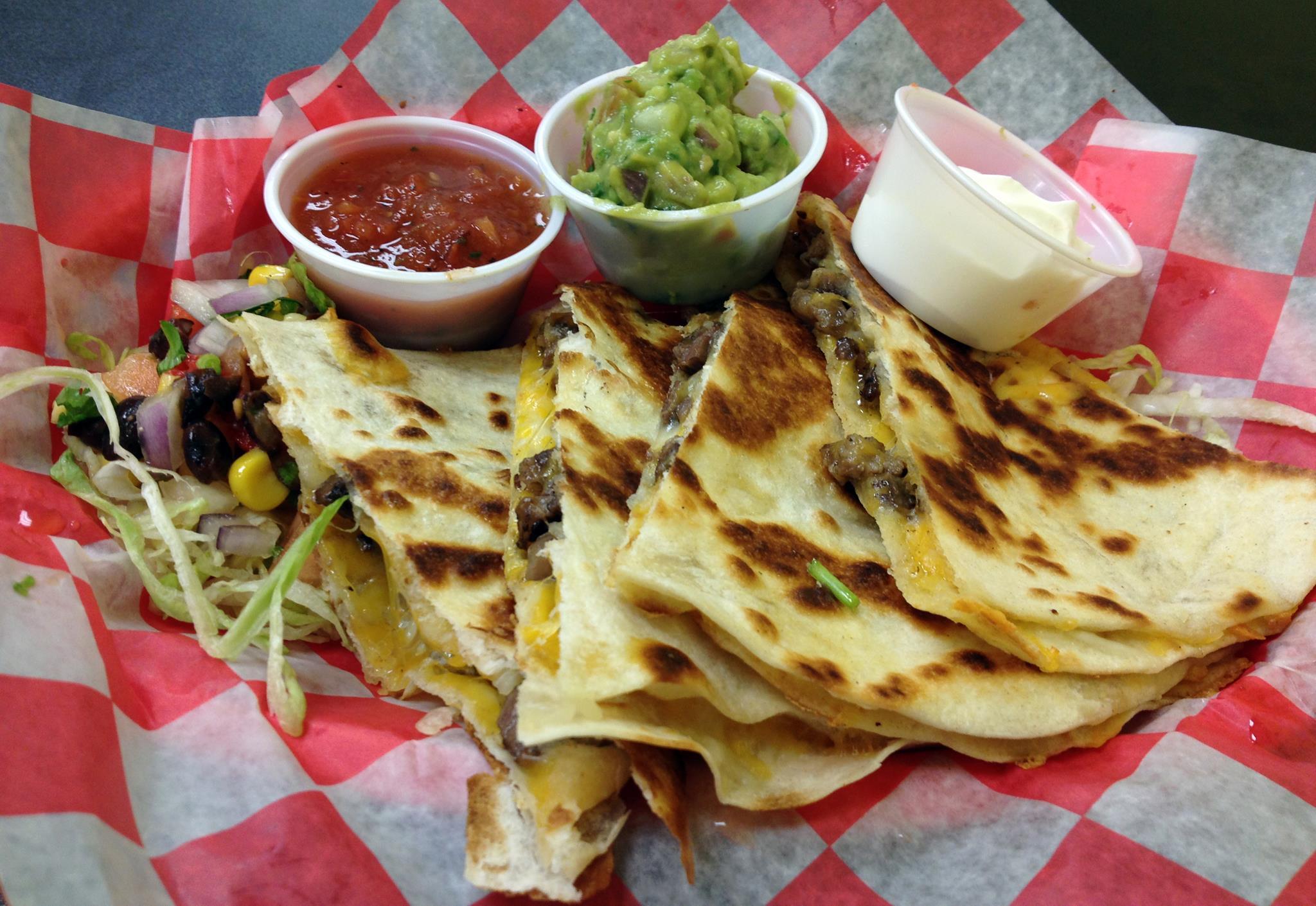 Fernando's Mexican grill signature dishes Barbacoa TacosBlackened Fish BurritoChicken Quesadilla